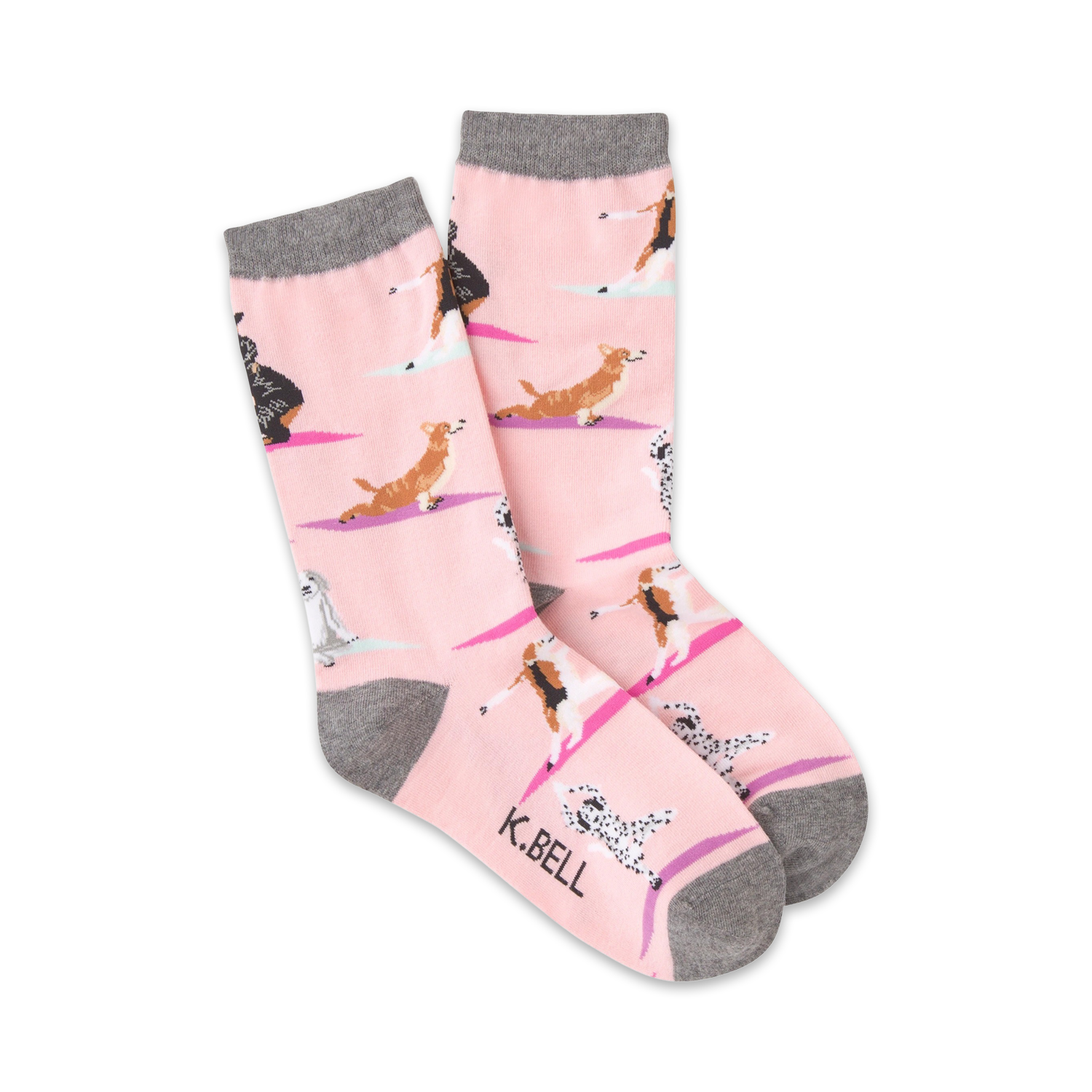 Pair of pink crew socks featuring yoga dogs in various poses. Gray cuff detail.