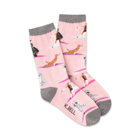 pink crew socks with gray toes, heels, and cuffs imprinted with a repeating pattern of cartoon dogs in various yoga poses. available in ladies sizes.   