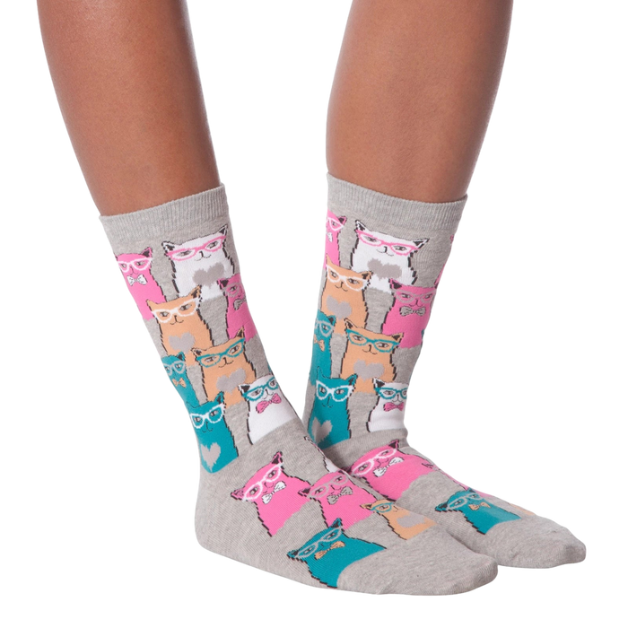 Lifestyle shot showing a model wearing white Smarty Cats socks.