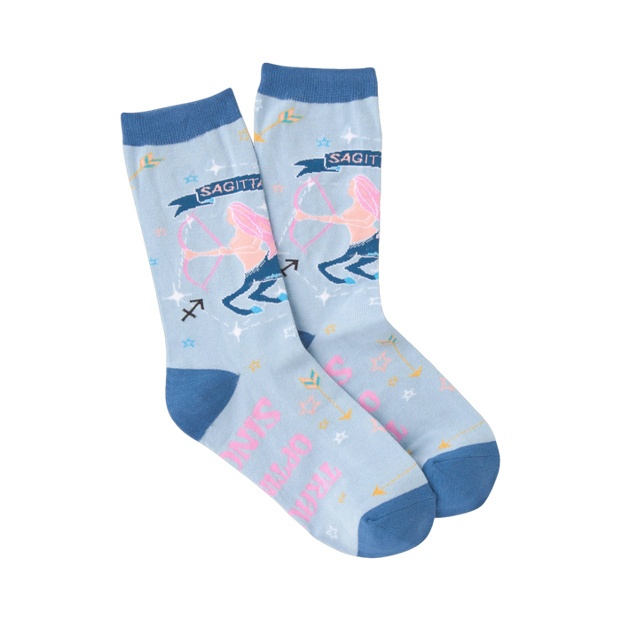 Pair of light blue crew socks with a Sagittarius zodiac design. Features pink Sagittarius figure, arrows, and stars.