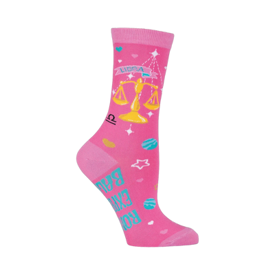 Pink crew socks with a Libra design. Features a gold scale, teal planets, stars, and the text 'Rock your balance'.