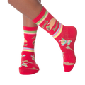 Lifestyle shot: Woman's legs wearing the 'Let's Taco Bout It' socks while casually holding a taco.