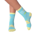 Close-up of a model's legs wearing the Beer Lime Sunshine socks.  Shows the socks on feet.