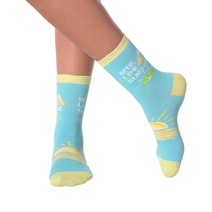 Close-up of a model's legs wearing the Beer Lime Sunshine socks.  Shows the socks on feet.