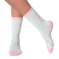 Lifestyle shot of woman's legs wearing 'Rose All Day' socks.