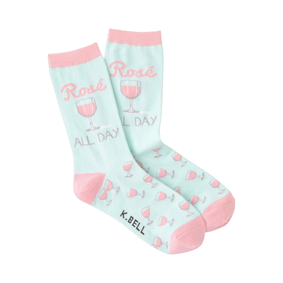 Pair of pastel pink and mint green crew socks.  Design features 'Rose All Day' text and pink rosé glasses.