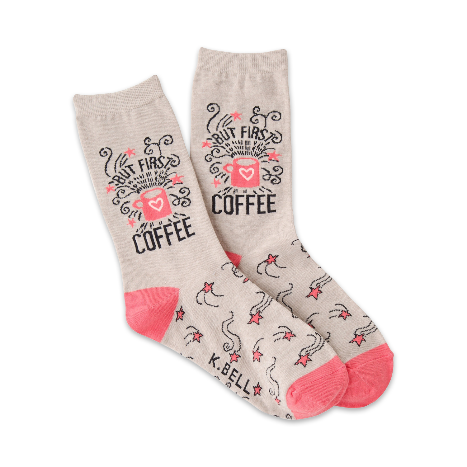 A pair of beige crew socks with a pink coffee cup design and shooting stars. The text 'But First, Coffee' is prominently displayed.