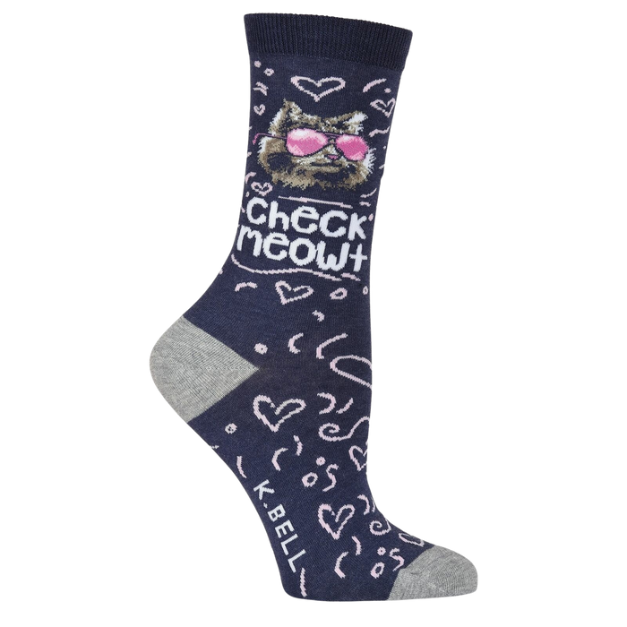 A person is shown wearing a pair of gray sneakers and blue socks with a cat wearing sunglasses design. The socks also have the words 