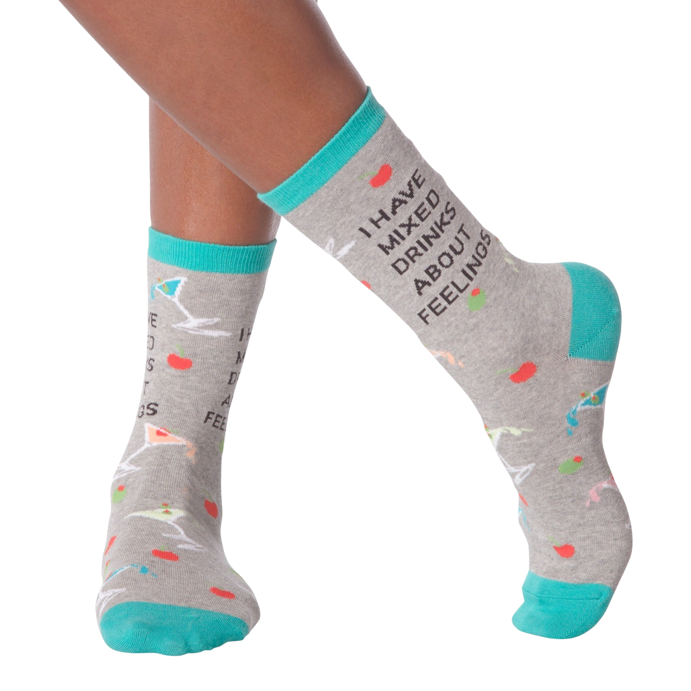 Lifestyle shot of woman's legs wearing the 'I Have Mixed Drinks About Feelings' socks, showing the fit and style on the feet.
