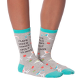Flat lay showcasing a pair of 'I Have Mixed Drinks About Feelings' socks, ideal for showing the overall design and color scheme.