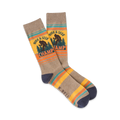 A pair of crew socks in taupe, yellow, and teal. They feature a Bigfoot graphic and the words 'Hide & Seek Champ'.