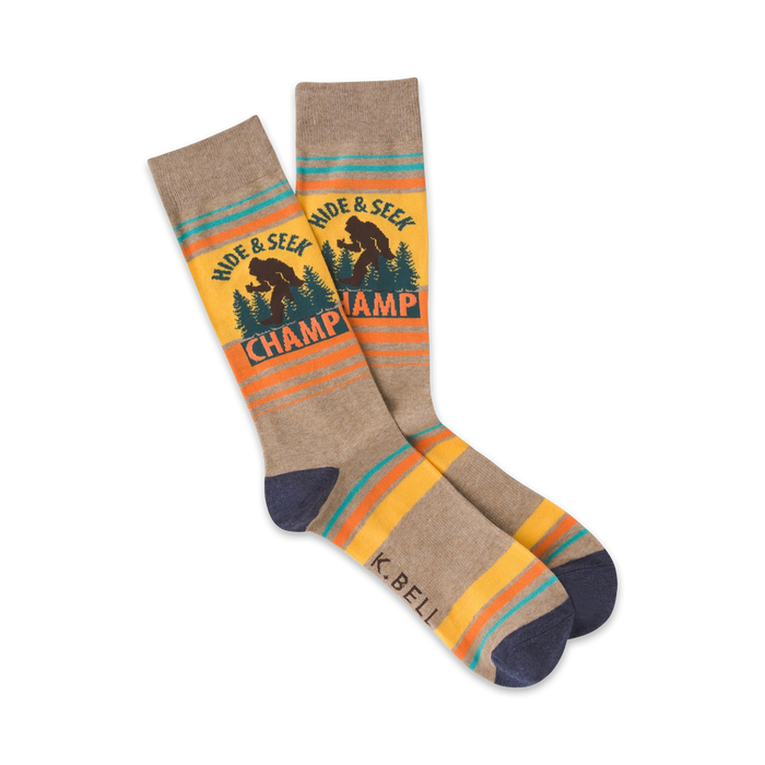 brown crew socks with colorful bigfoot pattern. text on socks reads 'hide & seek champ'   }}