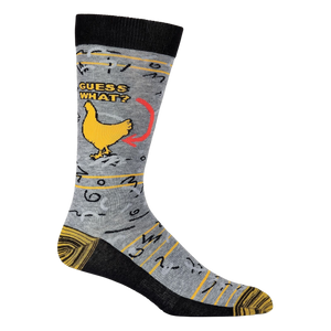 A pair of gray socks with a brown cuff. The socks have a pattern of chickens on them. The chicken has an arrow pointing to it with the words 