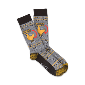 gray crew socks with yellow chicken feet pattern and the words "guess what?" pointing at the chickens rear printed on them.  