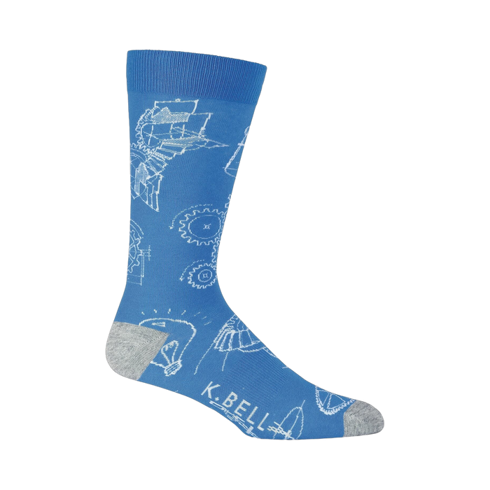 Blue crew socks with a white blueprint design featuring gears, lightbulbs, and mechanical drawings.  Grey heel and toe. }}