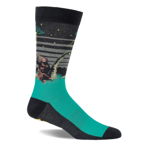 Single crew sock with dark grey top and teal foot, depicting Bigfoot, Loch Ness Monster, and a UFO at night.