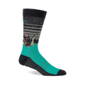 Single crew sock with dark grey top and teal foot, depicting Bigfoot, Loch Ness Monster, and a UFO at night.