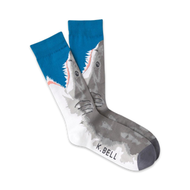 white crew socks with a pattern of great white sharks in gray with white bellies and open mouths, exposing sharp white teeth. blue toes and cuffs.   