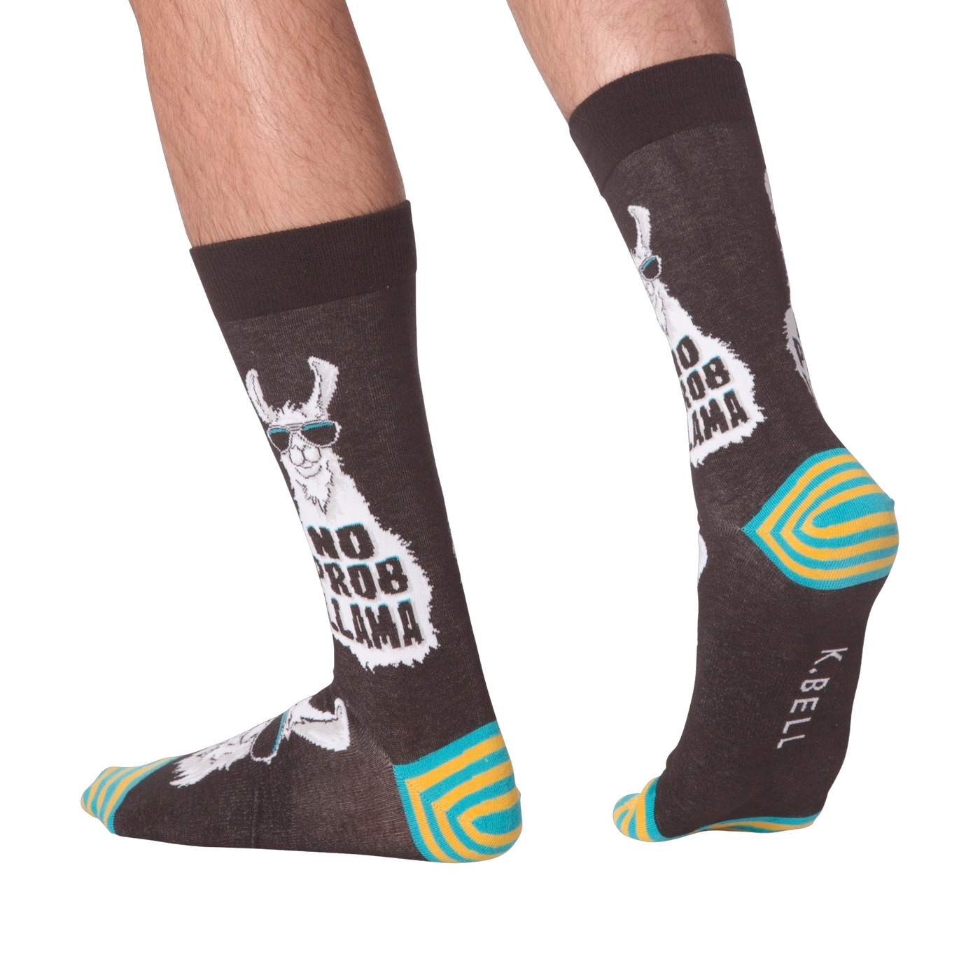 Lifestyle shot of 'No Prob Llama' socks on a person's feet. Shows the socks from the side and back.