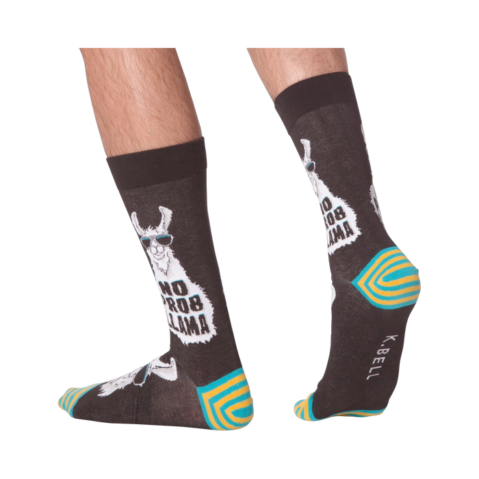 Lifestyle shot of 'No Prob Llama' socks on a person's feet. Shows the socks from the side and back.