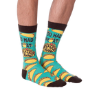 Another product shot of the 'You Had Me at Tacos' socks, showcasing the full sock design from a slightly different angle.