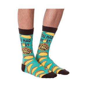 Another product shot of the 'You Had Me at Tacos' socks, showcasing the full sock design from a slightly different angle.