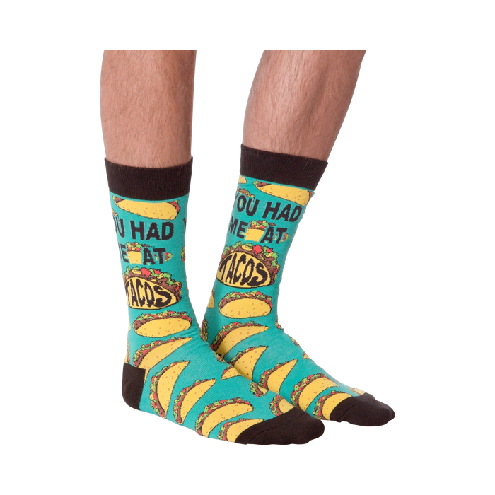 Another product shot of the 'You Had Me at Tacos' socks, showcasing the full sock design from a slightly different angle.