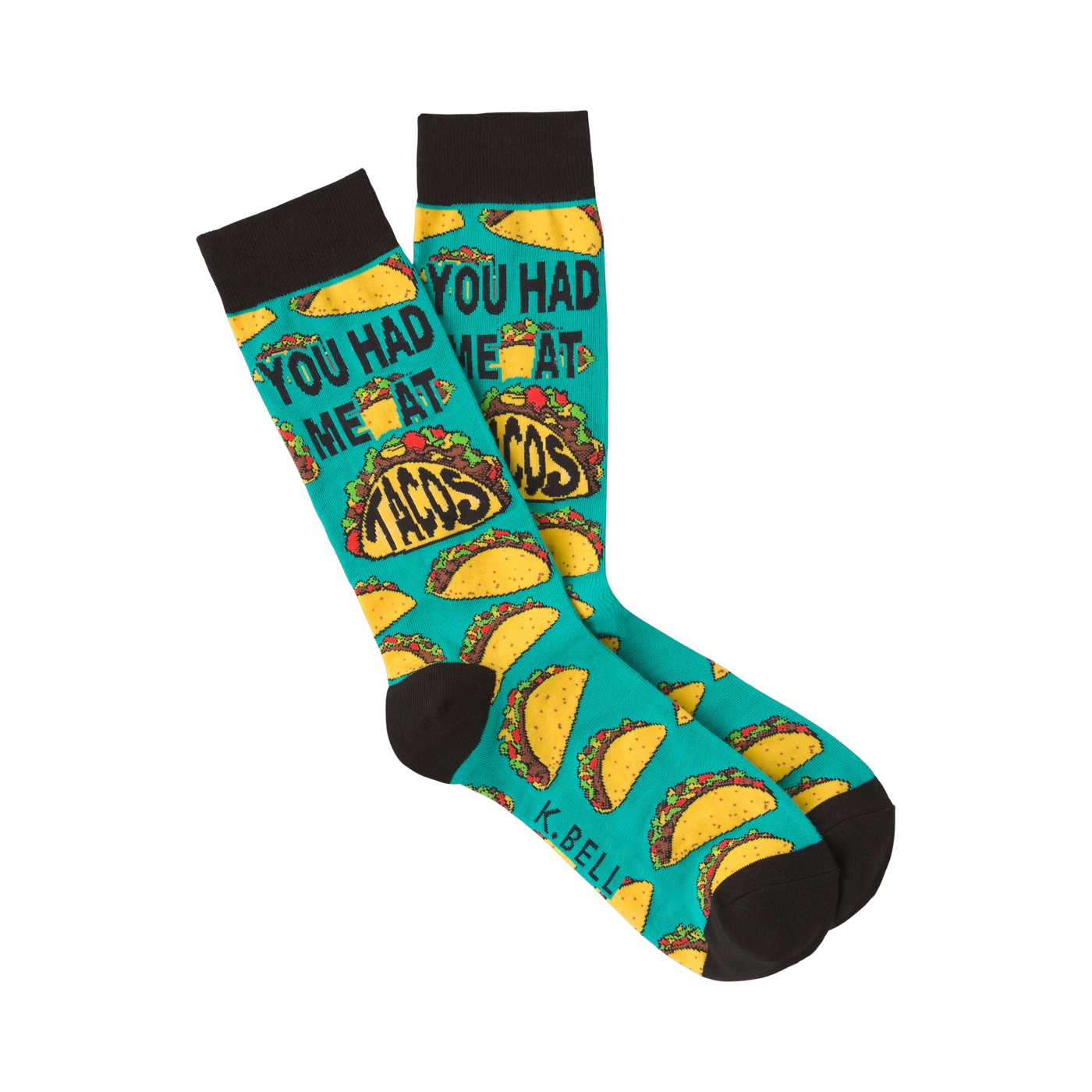 Pair of teal crew socks with a repeating pattern of tacos and the phrase 'You Had Me at Tacos.'  Black cuff.