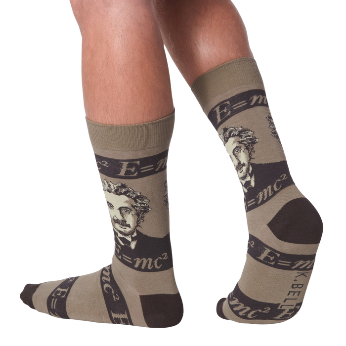 A pair of brown crew socks with a portrait of Albert Einstein and the equation E=mc2.