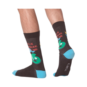 Lifestyle shot showing the 'Talk Birdie To Me' socks on a person's feet.