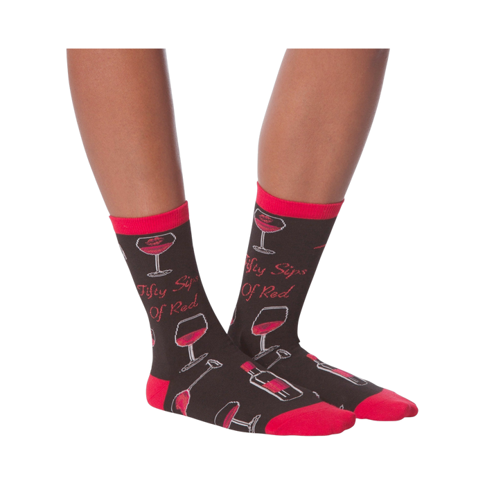 Another lifestyle shot showcasing the 'Fifty Sips of Red' socks on a model's legs from a slightly different angle.