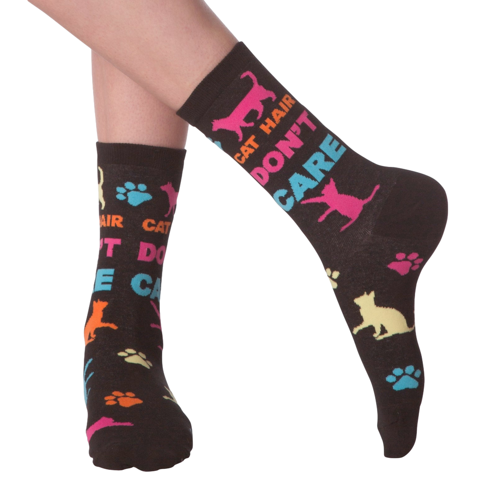 Lifestyle shot of a person wearing the 'Cat Hair Don't Care' socks. The socks are shown from the ankle to mid-calf.