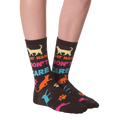 Flat lay shot of a pair of 'Cat Hair Don't Care' socks. The image highlights the sock's design and pattern.