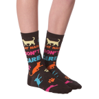 Flat lay shot of a pair of 'Cat Hair Don't Care' socks. The image highlights the sock's design and pattern.