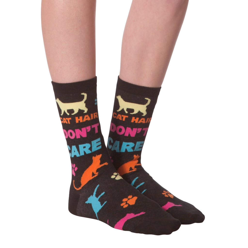 Flat lay shot of a pair of 'Cat Hair Don't Care' socks. The image highlights the sock's design and pattern.