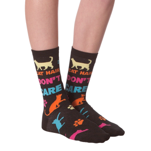 Flat lay shot of a pair of 'Cat Hair Don't Care' socks. The image highlights the sock's design and pattern.