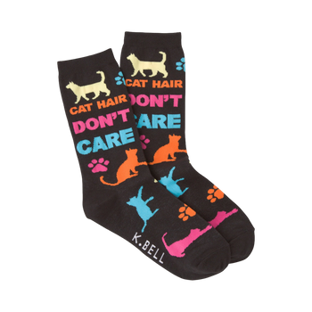 A pair of dark-colored crew socks with a playful design. The socks feature colorful cat silhouettes, paw prints, and the text 'Cat Hair Don't Care'.