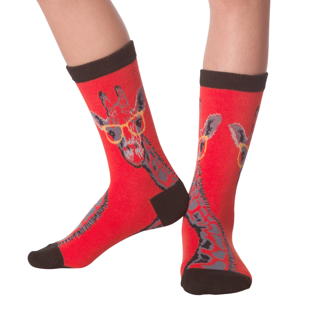 Lifestyle shot showing the socks on a person's legs.  The socks are red with a giraffe pattern.