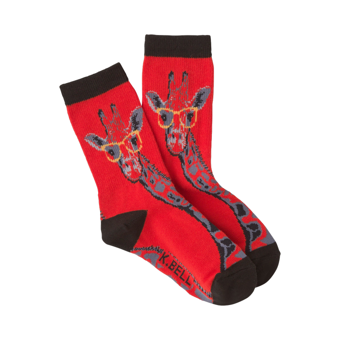Pair of red crew socks with a pattern of giraffes wearing glasses. The giraffes are gray and the glasses are yellow.