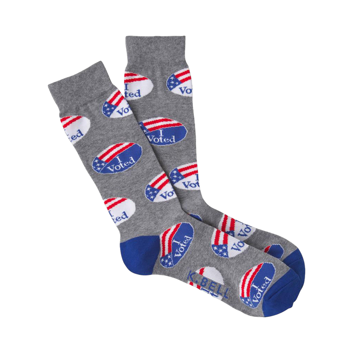 Gray crew socks with a repeating pattern of blue and red 'I Voted' stickers.  The toe and heel are royal blue. }}