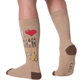 Lifestyle shot of a person wearing the tan 'Draft Beer' socks. The design is partially visible.