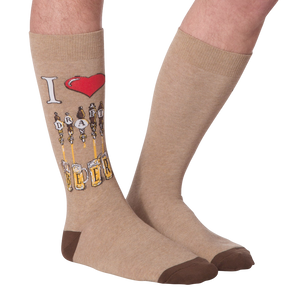 Flat lay of a pair of tan 'Draft Beer' socks showing the full design, including the 'I heart Draft Beer' graphic and beer tap image.