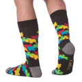 Lifestyle shot of a person wearing the 3D Puzzle Socks, showcasing the fit and design.