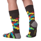 Lifestyle shot of a person wearing the 3D Puzzle Socks, showcasing the fit and design.
