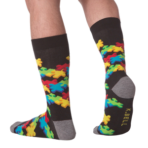 Lifestyle shot of a person wearing the 3D Puzzle Socks, showcasing the fit and design.