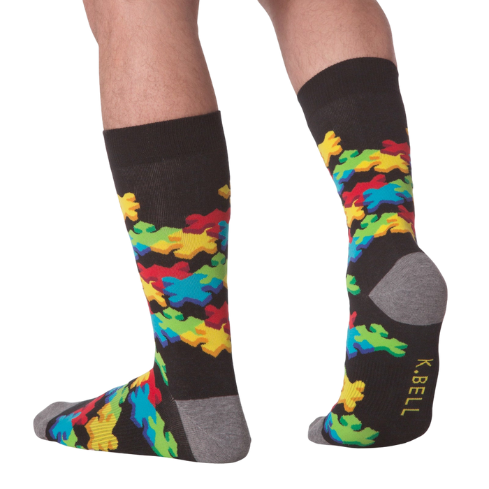 Lifestyle shot of a person wearing the 3D Puzzle Socks, showcasing the fit and design.