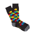 Black crew socks with a colorful 3D puzzle piece design.  Features red, yellow, blue, and green puzzle pieces.