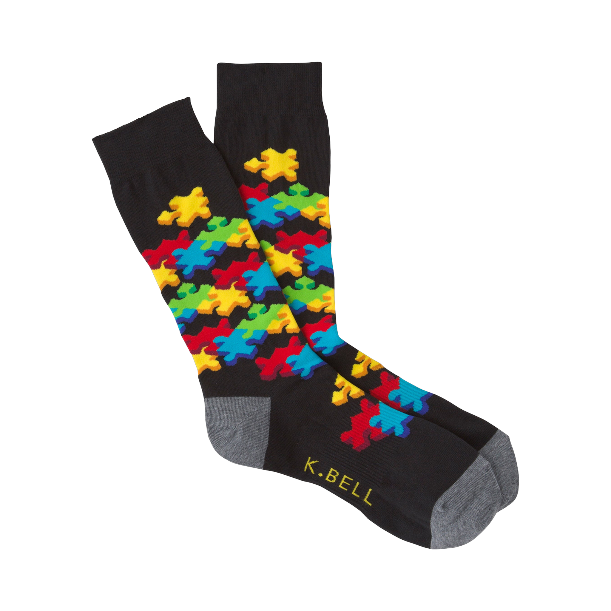 Black crew socks with a colorful 3D puzzle piece design.  Features red, yellow, blue, and green puzzle pieces.