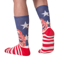Rear view of 'Don't Tread' socks on a person's legs.