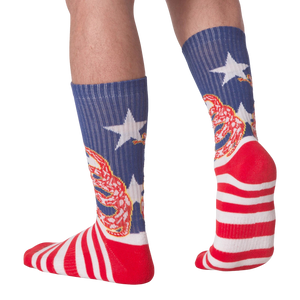 Rear view of 'Don't Tread' socks on a person's legs.